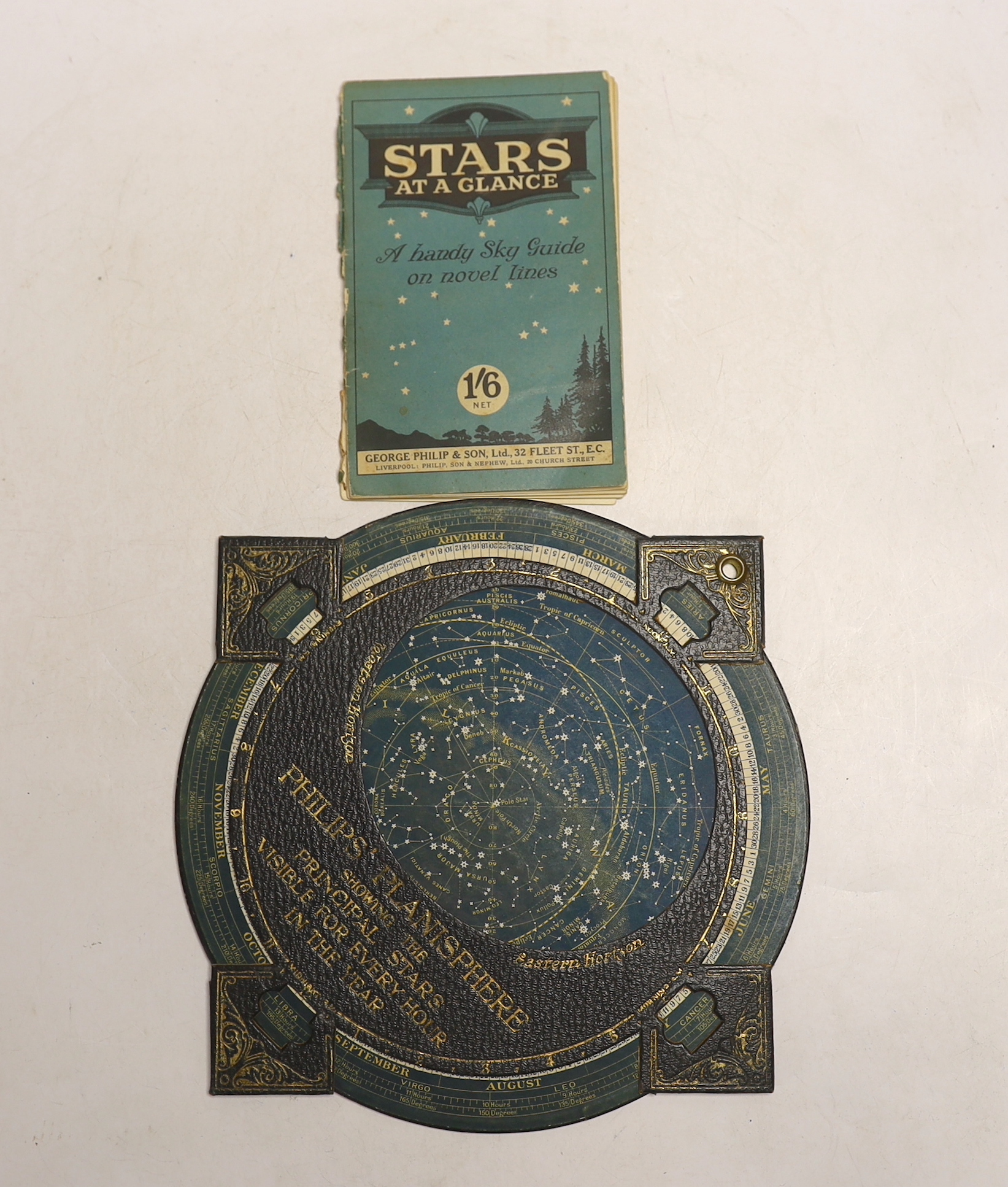 A Philips Planisphere showing principle stars visible every hour in the year and a volume of ‘Stars at a Glance’ pub. by Philip & Son, Planisphere 31cm high